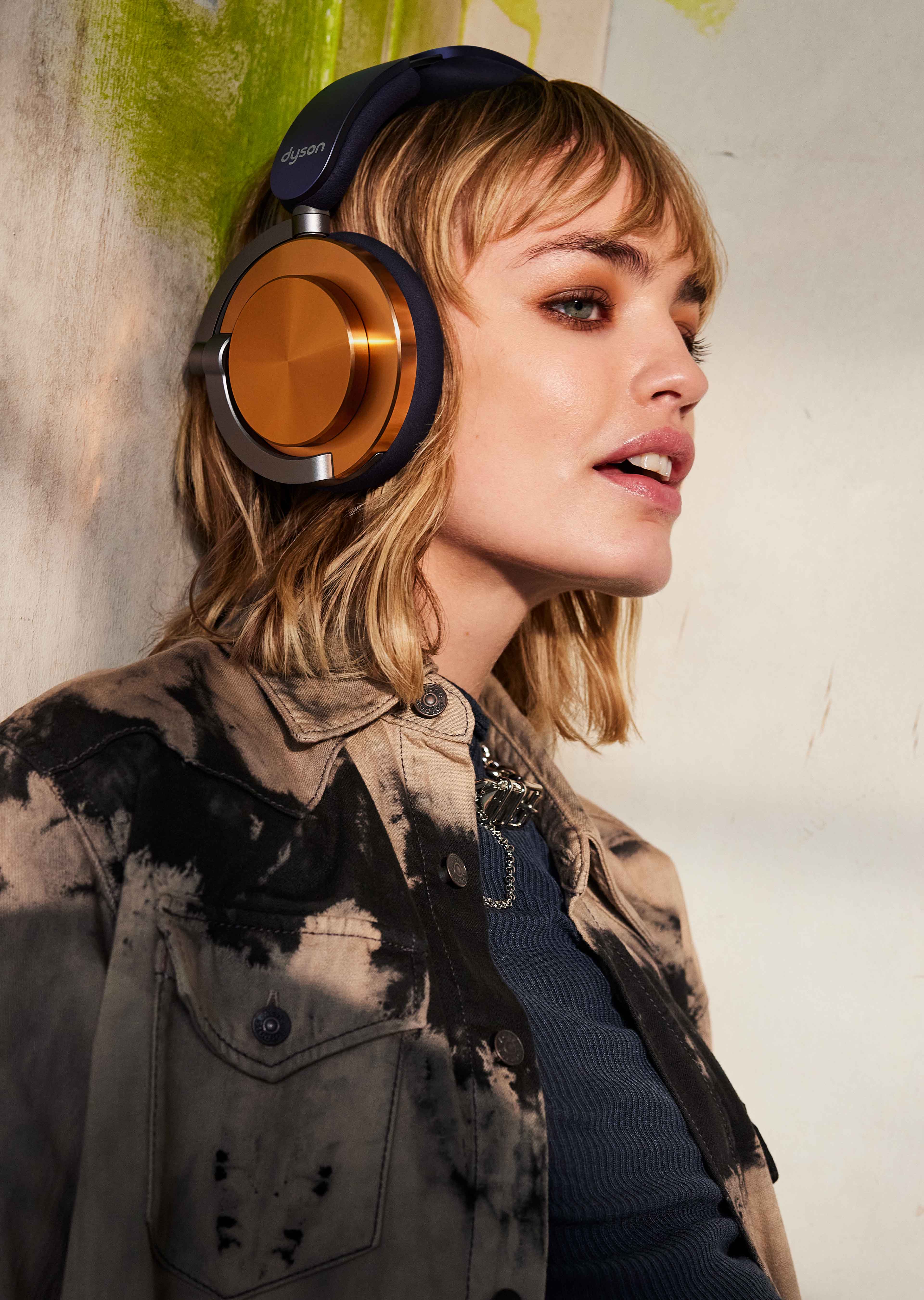 A model wearing the Dyson OnTrac headphones.